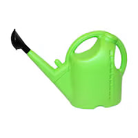Green watering can on a white background