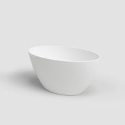 White ceramic bowl on a light gray background