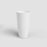 White ceramic vase on a light gray background