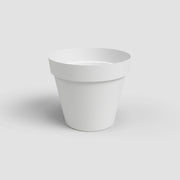 White flower pot on a light gray background