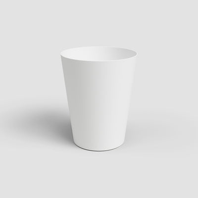 White ceramic planter on a light gray background