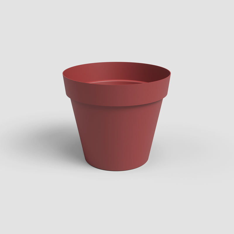 Red flower pot on a light gray background