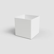 White cube-shaped planter on a light gray background