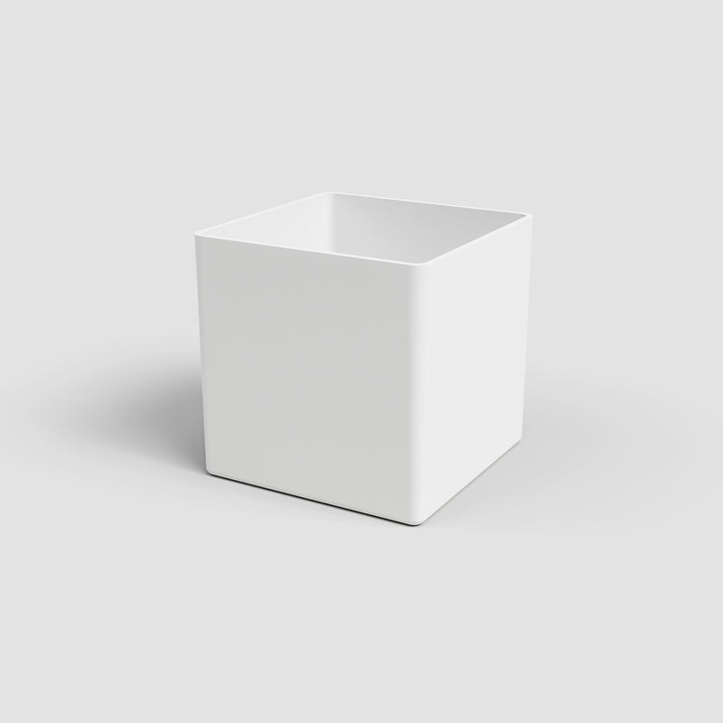 White cube-shaped planter on a light gray background