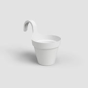 White hanging planter on a light gray background