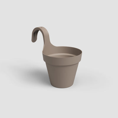 Beige hanging planter on a light gray background