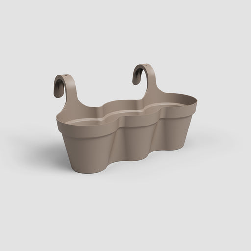 Beige wall-mounted plant holder with hooks on a light gray background