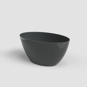 Black ceramic bowl on a light gray background