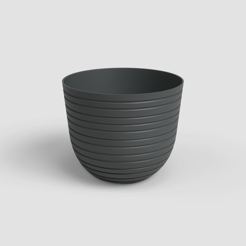 Dark gray ribbed pot on a light gray background