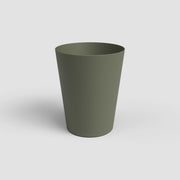 Green plastic cup on a white background