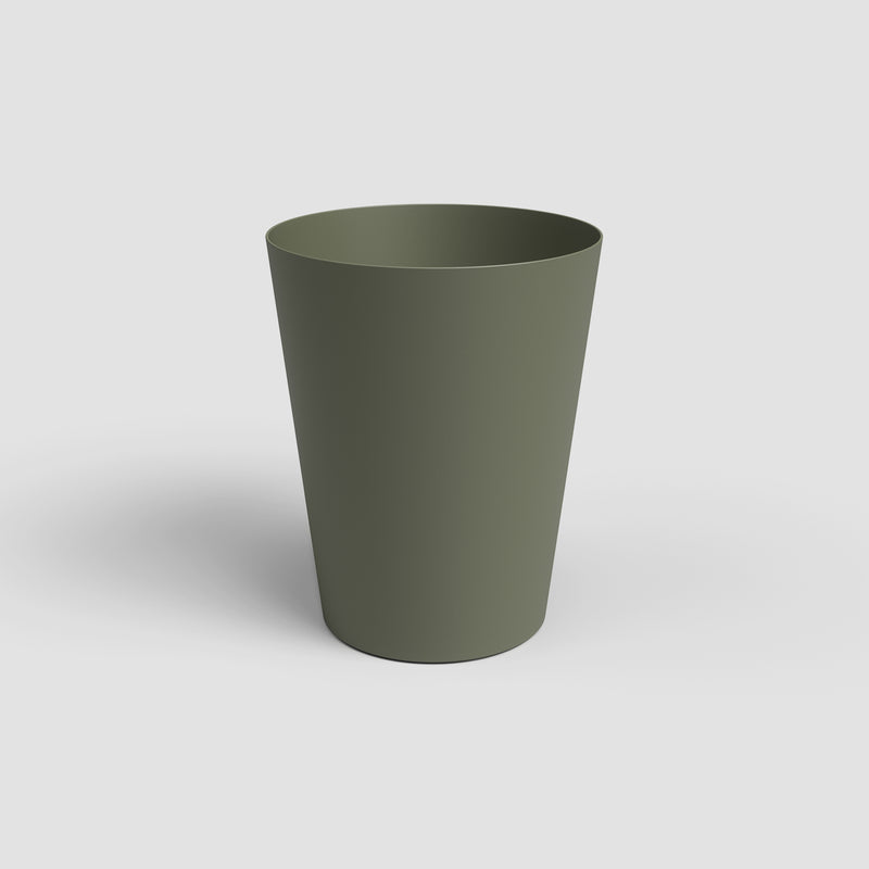 Green plastic cup on a white background