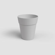White flower pot on a light gray background