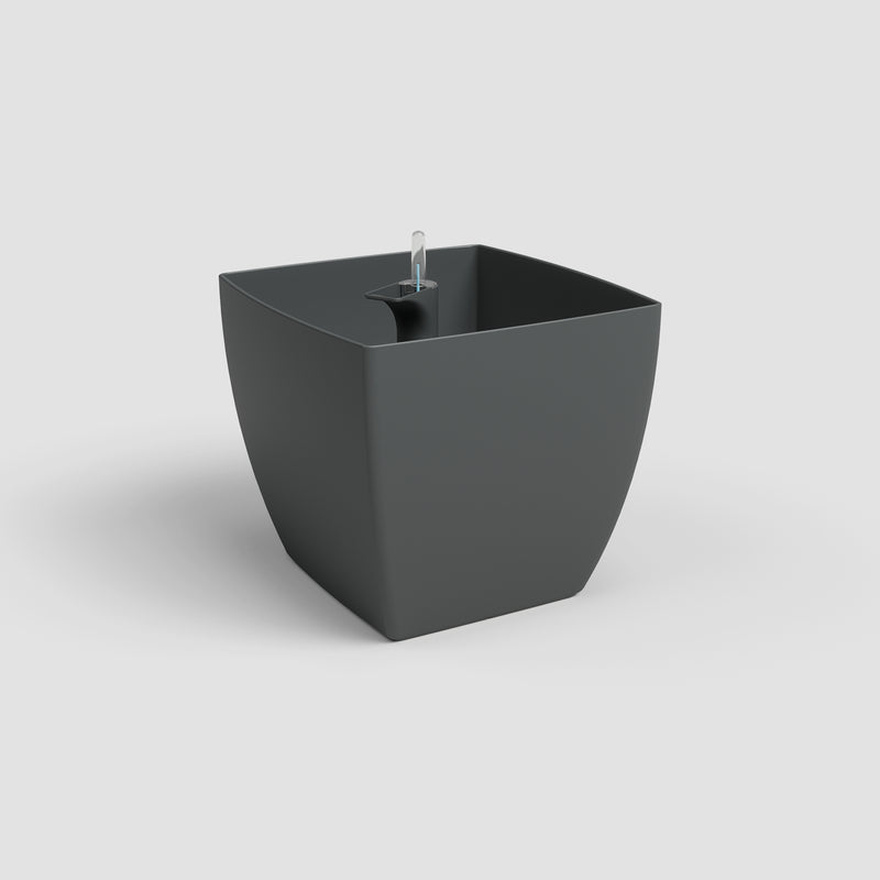 Black freestanding bathtub on a light gray background