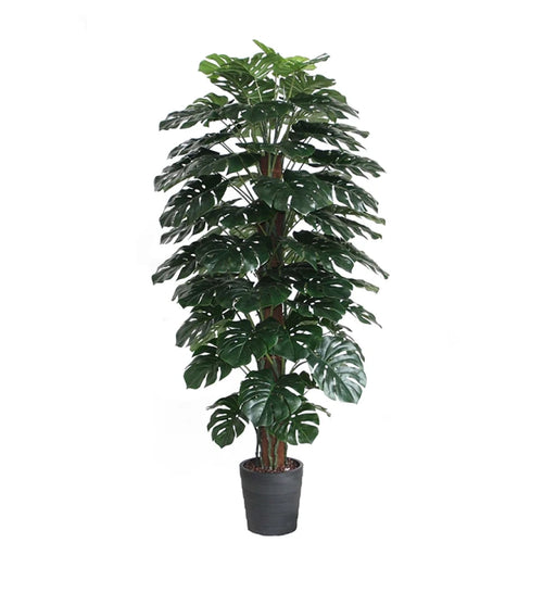 Artificial monstera plant in a pot on a white background