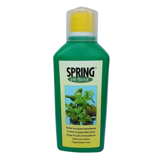 Green bottle of Spring Pro Florist plant fertilizer on a white background