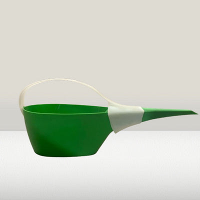 Green watering can with a white handle on a light gray background
