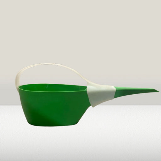 Green watering can with a white handle on a light gray background