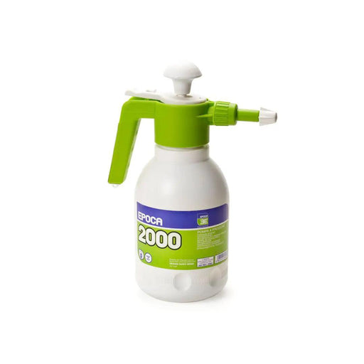 Spray bottle with green nozzle and white body on a white background