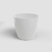White ceramic planter on a light gray background