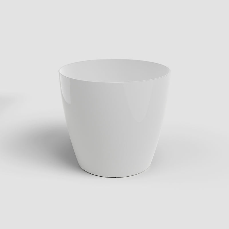 White ceramic planter on a light gray background