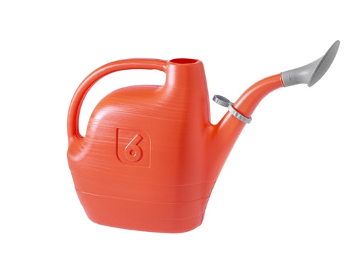 Orange watering can with a silver nozzle on a white background